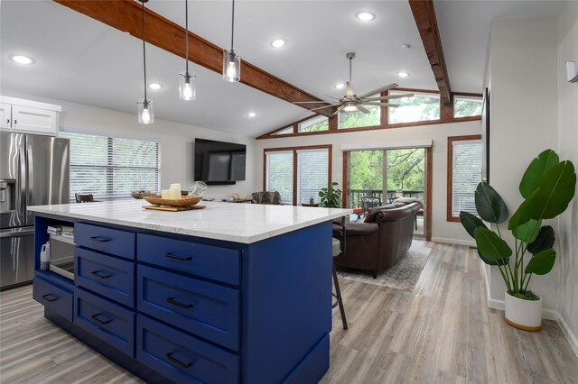 207 Wales Dr, Pottsboro, TX 75076 - kitchen with stainless steel fridge with ice dispenser, blue cabinetry, open floor plan, white cabinetry, and a ceiling fan