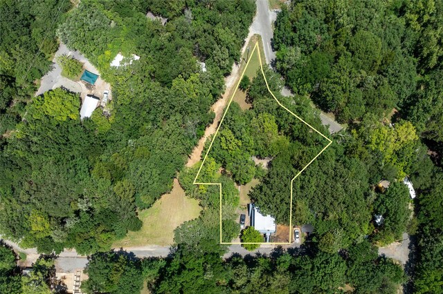 207 Wales Dr, Pottsboro, TX 75076 - view of yard with an outdoor fire pit and a view of trees