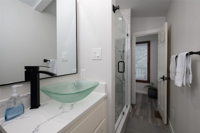 207 Wales Dr, Pottsboro, TX 75076 - bathroom featuring a marble finish shower, vanity, and wood finished floors