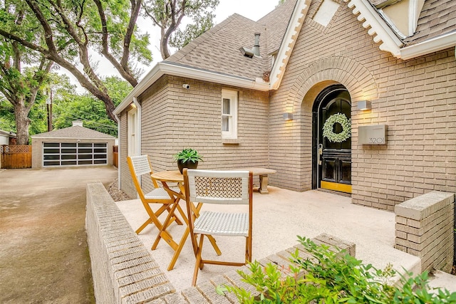 3201 Lamesa Pl, Fort Worth, TX 76109 - view of patio with an outbuilding, a detached garage, and outdoor dining area