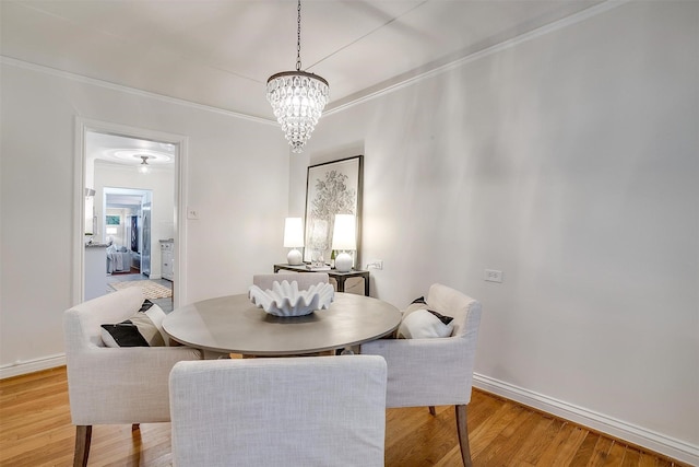 3201 Lamesa Pl, Fort Worth, TX 76109 - dining room with light wood-style flooring, ornamental molding, a chandelier, and baseboards
