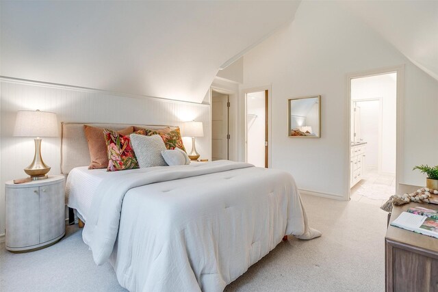 3201 Lamesa Pl, Fort Worth, TX 76109 - bedroom featuring light carpet, vaulted ceiling, a walk in closet, connected bathroom, and baseboards