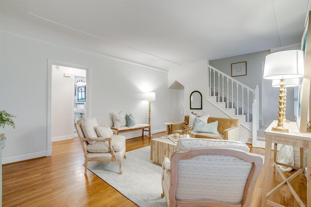 3201 Lamesa Pl, Fort Worth, TX 76109 - living room featuring light wood-type flooring, stairway, baseboards, and ornamental molding