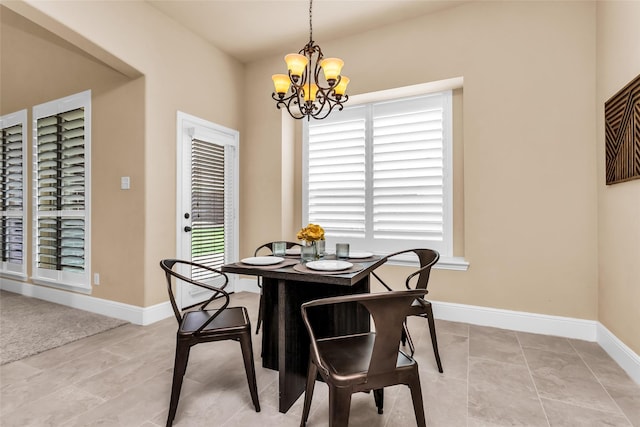 4312 Oxbow Dr, Mckinney, TX 75072 - dining room featuring a chandelier and baseboards