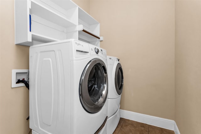 4312 Oxbow Dr, Mckinney, TX 75072 - washroom with separate washer and dryer, tile patterned flooring, and baseboards