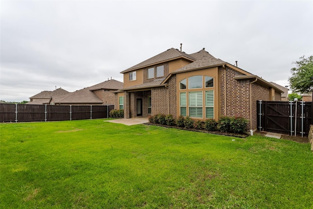 4312 Oxbow Dr, Mckinney, TX 75072 - rear view of house featuring brick siding, a patio area, roof with shingles, and a gate