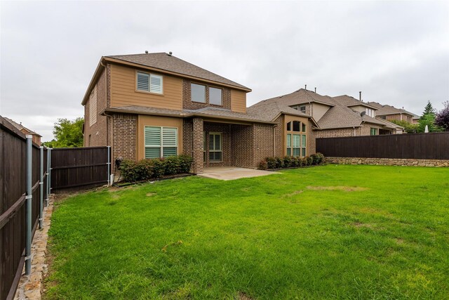 4312 Oxbow Dr, Mckinney, TX 75072 - back of house featuring brick siding, a patio area, and roof with shingles