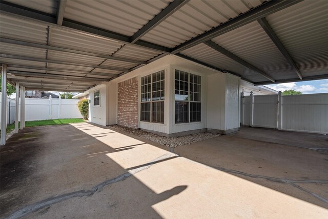 1326 Rosewood Ln, Lancaster, TX 75146 - view of patio featuring an attached carport