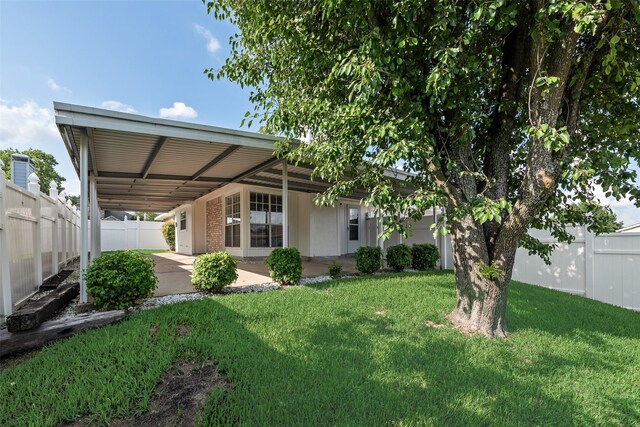 1326 Rosewood Ln, Lancaster, TX 75146 - view of yard featuring a patio area and an attached carport