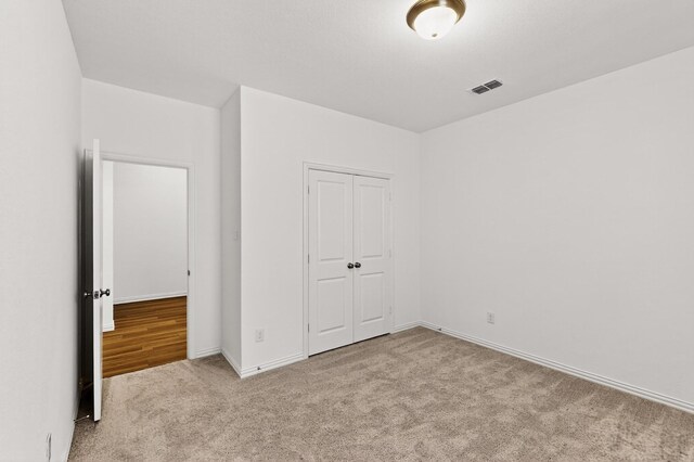 3804 Honeycomb Holw, Melissa, TX 75454 - unfurnished bedroom with carpet, a closet, and baseboards