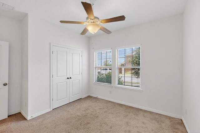 3804 Honeycomb Holw, Melissa, TX 75454 - unfurnished bedroom featuring carpet flooring, baseboards, a closet, and a ceiling fan