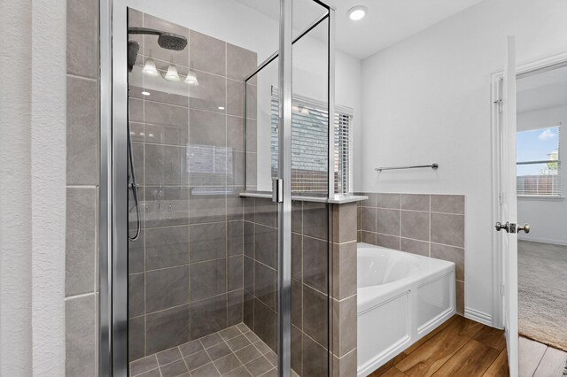 3804 Honeycomb Holw, Melissa, TX 75454 - bathroom with a garden tub, a shower stall, and wood finished floors
