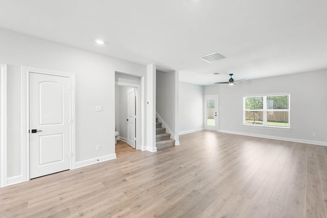 332 Live Oak Ln, Hutchins, TX 75141 - unfurnished living room featuring ceiling fan, stairway, light wood-style flooring, baseboards, and recessed lighting