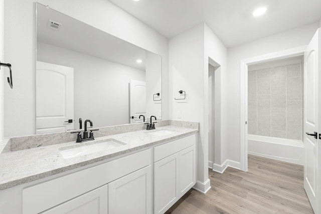 332 Live Oak Ln, Hutchins, TX 75141 - full bathroom featuring double vanity, wood finished floors, baseboards, and recessed lighting