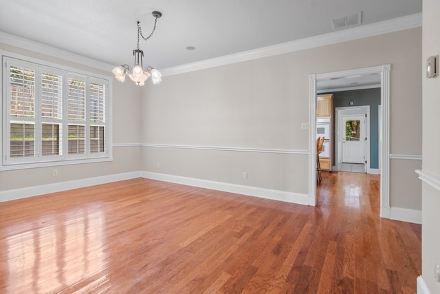 504 Hilltop Pl, Joshua, TX 76058 - unfurnished room with a chandelier, ornamental molding, light wood-type flooring, and baseboards