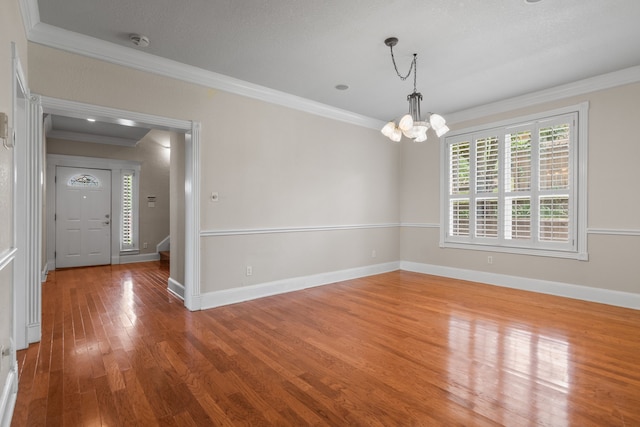 504 Hilltop Pl, Joshua, TX 76058 - spare room with ornamental molding, wood finished floors, a chandelier, baseboards, and a smoke detector