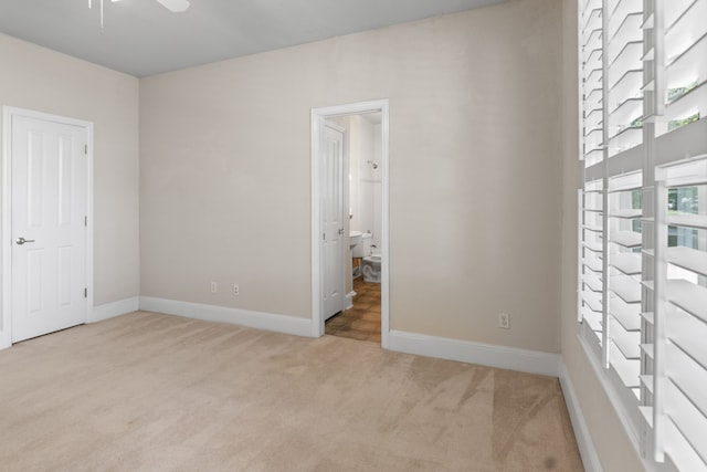 504 Hilltop Pl, Joshua, TX 76058 - unfurnished bedroom featuring carpet floors, baseboards, and connected bathroom