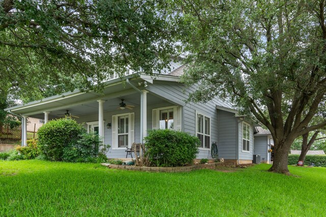504 Hilltop Pl, Joshua, TX 76058 - view of front facade featuring a ceiling fan, a front yard, covered porch, and cooling unit