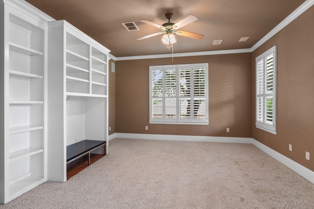 504 Hilltop Pl, Joshua, TX 76058 - unfurnished living room with ceiling fan, carpet floors, baseboards, ornamental molding, and a textured ceiling