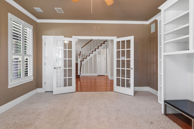 504 Hilltop Pl, Joshua, TX 76058 - carpeted spare room featuring french doors, ornamental molding, plenty of natural light, and stairway