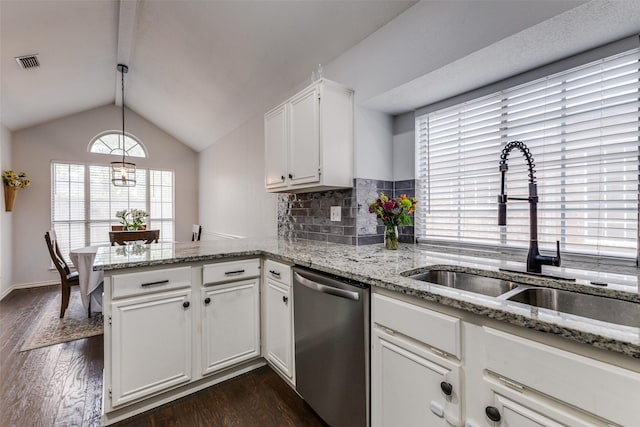 143 Westwood Dr, Rockwall, TX 75032 - kitchen with dishwasher, a sink, a peninsula, dark wood finished floors, and lofted ceiling