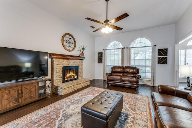 143 Westwood Dr, Rockwall, TX 75032 - living area featuring dark wood-type flooring, a ceiling fan, a brick fireplace, and lofted ceiling