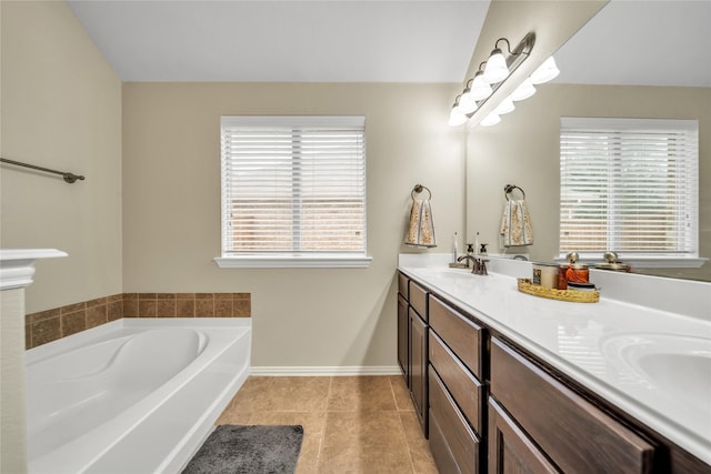 583 Louder Way, Fate, TX 75087 - full bathroom with double vanity, a garden tub, tile patterned flooring, and baseboards
