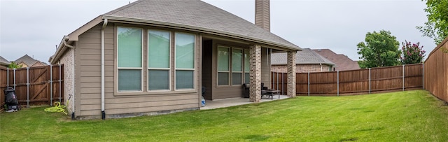 583 Louder Way, Fate, TX 75087 - back of property featuring a chimney, a patio, and roof with shingles