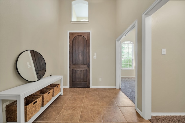 583 Louder Way, Fate, TX 75087 - entrance foyer with baseboards, a high ceiling, and tile patterned floors