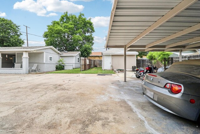 2704 Travis Ave, Fort Worth, TX 76110 - covered parking lot with a shed