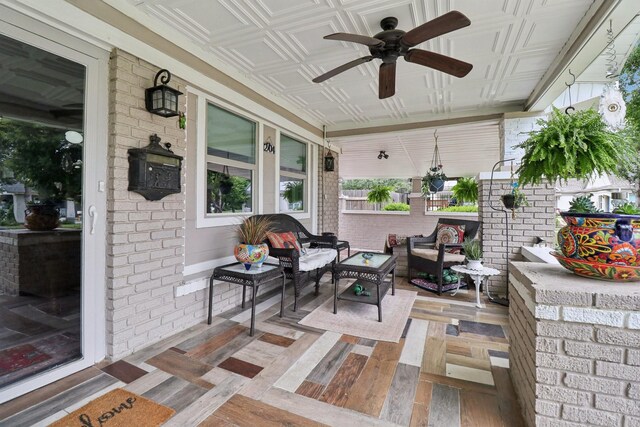 2704 Travis Ave, Fort Worth, TX 76110 - porch featuring outdoor lounge area and ceiling fan