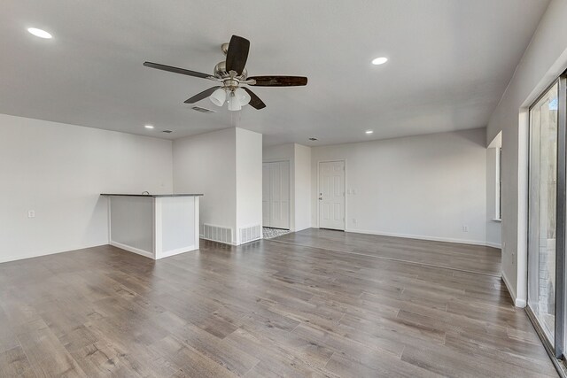 816 Northwood Rd, Fort Worth, TX 76107 - empty room featuring ceiling fan, recessed lighting, wood finished floors, and baseboards