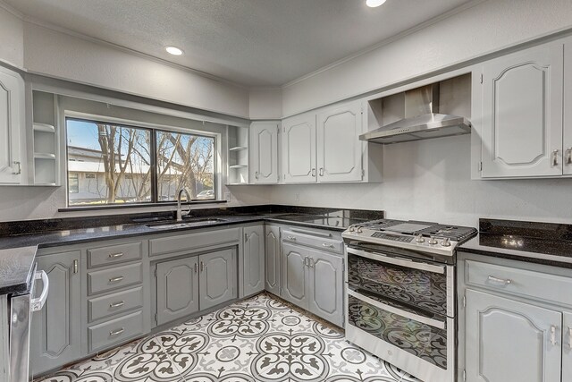 816 Northwood Rd, Fort Worth, TX 76107 - kitchen with wall chimney exhaust hood, a sink, open shelves, range with two ovens, and a textured ceiling