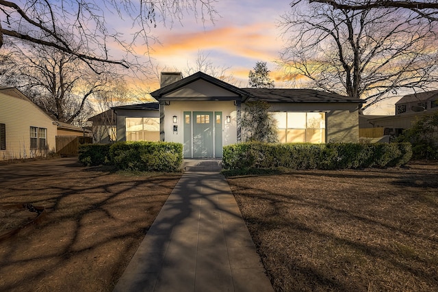 816 Northwood Rd, Fort Worth, TX 76107 - view of front of home with a chimney and stucco siding