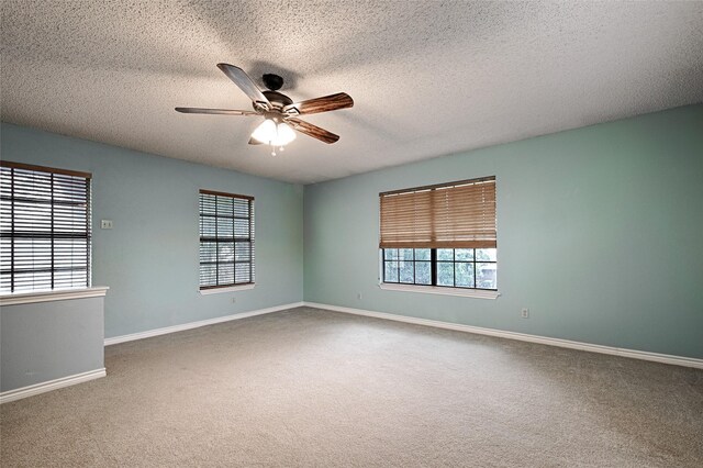 614 Brookfield Dr, Garland, TX 75040 - carpeted spare room with a ceiling fan, baseboards, and a textured ceiling