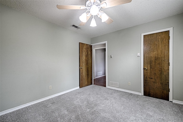 614 Brookfield Dr, Garland, TX 75040 - unfurnished bedroom featuring carpet, a textured ceiling, baseboards, and a ceiling fan