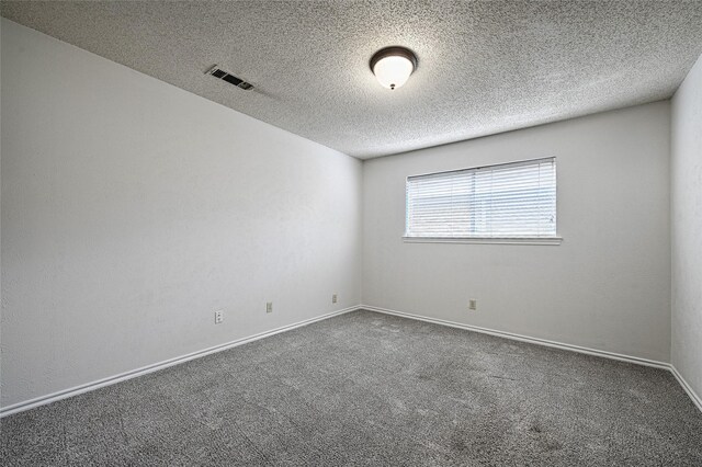 614 Brookfield Dr, Garland, TX 75040 - carpeted empty room with a textured ceiling and baseboards