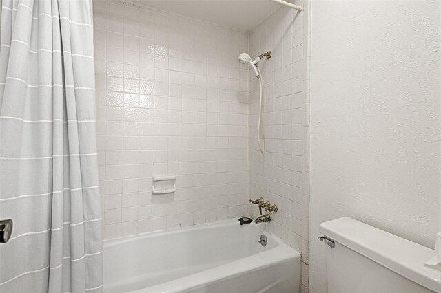 614 Brookfield Dr, Garland, TX 75040 - full bathroom featuring shower / bath combo with shower curtain and toilet