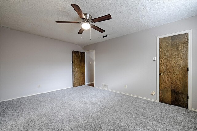 614 Brookfield Dr, Garland, TX 75040 - unfurnished bedroom with carpet, baseboards, and a textured ceiling
