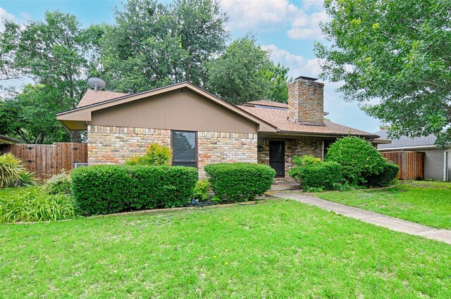614 Brookfield Dr, Garland, TX 75040 - view of front of property with a chimney and brick siding