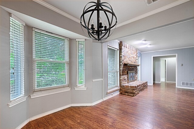 614 Brookfield Dr, Garland, TX 75040 - unfurnished living room featuring ornamental molding, wood finished floors, baseboards, and healthy amount of natural light