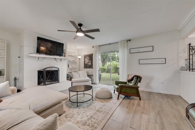 3008 Albany Dr, Mesquite, TX 75150 - living area with a brick fireplace, ceiling fan, wood finished floors, and baseboards