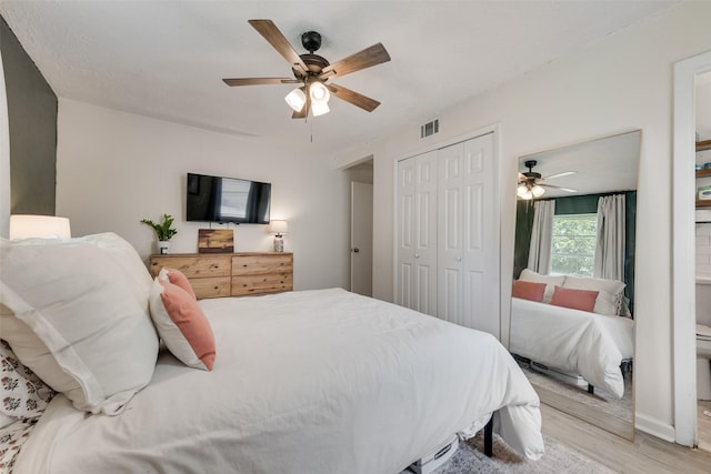 3008 Albany Dr, Mesquite, TX 75150 - bedroom featuring light wood-style floors, a closet, and ceiling fan