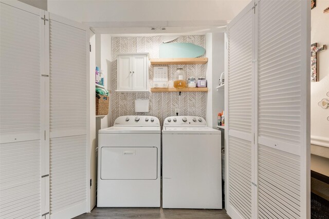 3008 Albany Dr, Mesquite, TX 75150 - washroom with washer and dryer, cabinet space, and wood finished floors