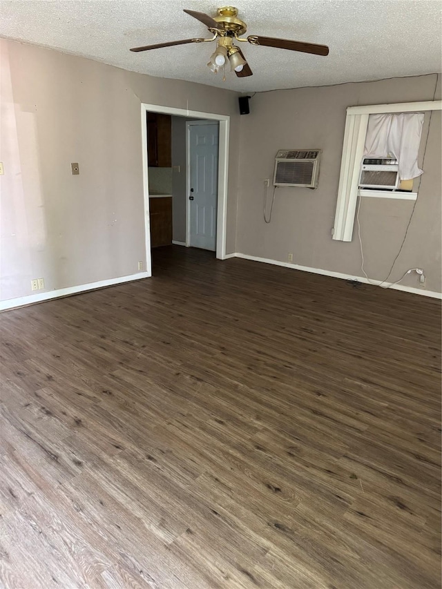407 W 12th St, Quanah, TX 79252 - spare room with a wall mounted AC, ceiling fan, wood finished floors, cooling unit, and a textured ceiling