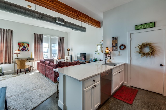 2502 Live Oak St Unit 322, Dallas, TX 75204 - kitchen with stainless steel dishwasher, white cabinets, open floor plan, beamed ceiling, and light stone counters