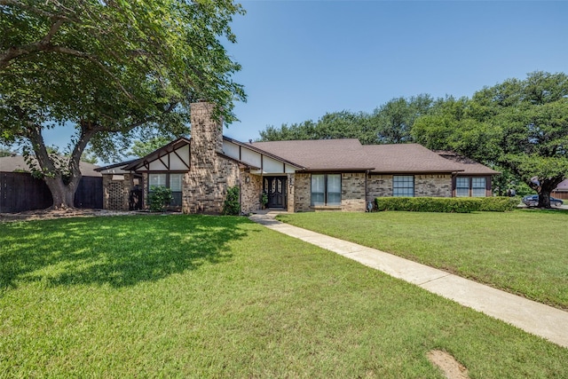 101 Circleview Dr S, Hurst, TX 76054 - view of front of property featuring a front yard, a chimney, and brick siding