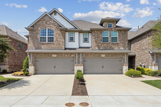 984 Mikaela Dr, Allen, TX 75013 - view of front facade with an attached garage, concrete driveway, roof with shingles, stone siding, and stucco siding