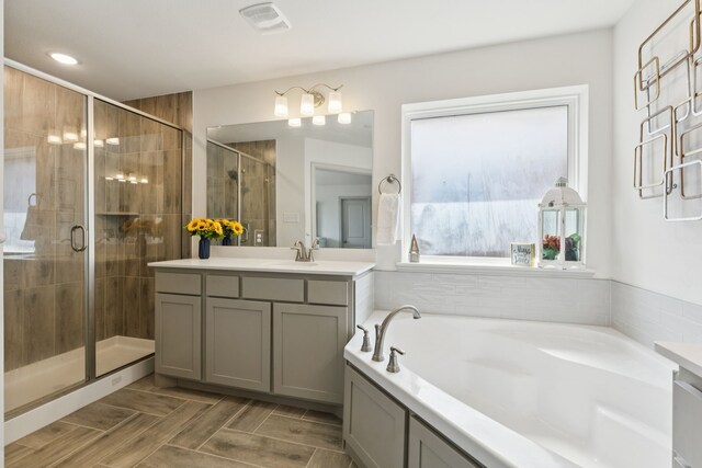 984 Mikaela Dr, Allen, TX 75013 - full bathroom with vanity, a shower stall, a bath, and recessed lighting