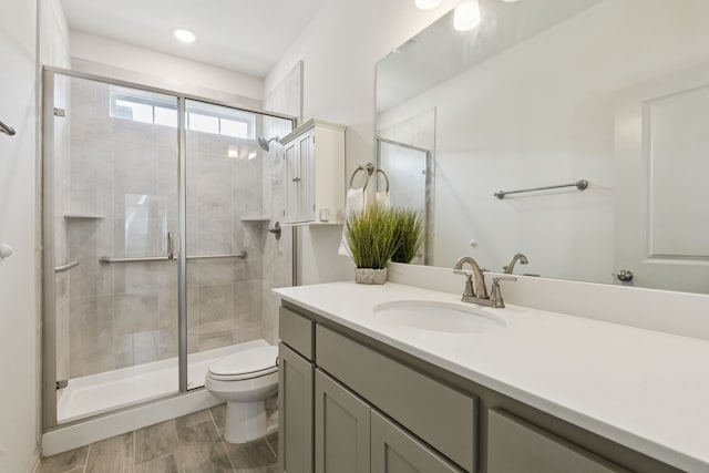 984 Mikaela Dr, Allen, TX 75013 - full bath with toilet, vanity, a shower stall, and wood finished floors